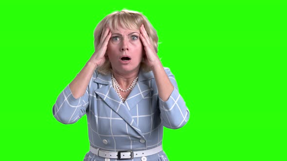 Horrified Mature Woman on Green Screen. alt