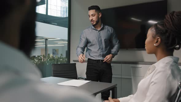 Arabian Indian Male Leader Negotiating with Business Group Investors Explaining Contract Benefits alt