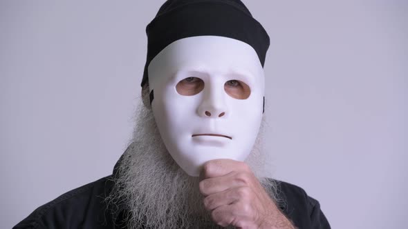 Mature Bearded Hipster Man Revealing Face and Smiling alt