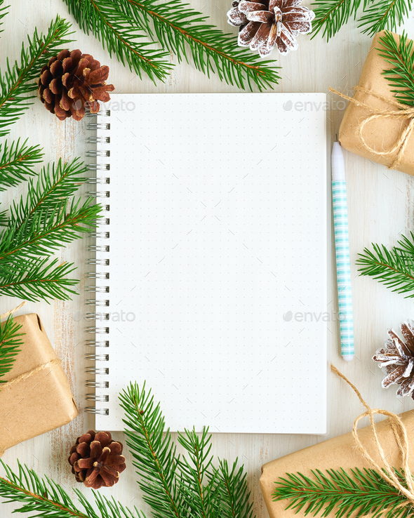 White open notepad, bullet journal for wish list and Christmas decoration on white wooden background - Stock Photo - Images