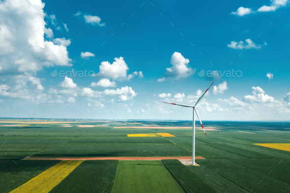Aerial view of wind turbines on modern wind farm from drone pov - Stock Photo - Images