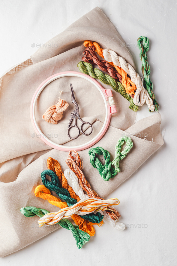 Embroidery set. Linen fabric, embroidery patterns, embroidery hoop, colorful threads and needls. - Stock Photo - Images