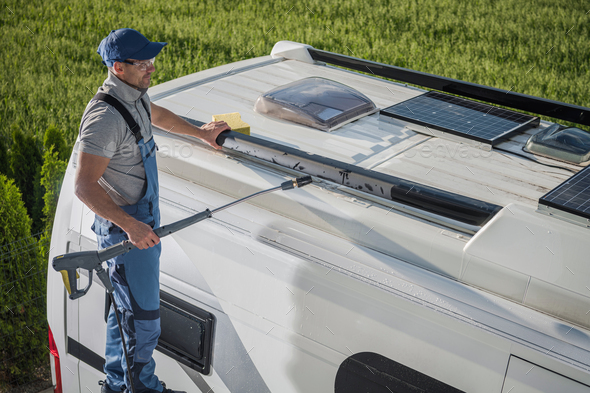 Smiling Caucasian Men Washing His Motorhome RV Camper Van - Stock Photo - Images