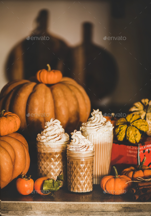 Pumpkin latte coffee decorated with whipped cream in glasses - Stock Photo - Images