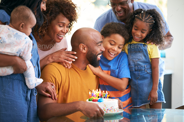 Multi-Generation African American Family Celebrating Fathers Birthday At Home Together
