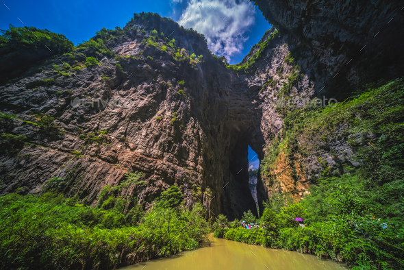 Tourists on a path along stream in Wulong National Park - Stock Photo - Images