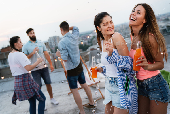 Having a great time with friends, having fun at rooftop party