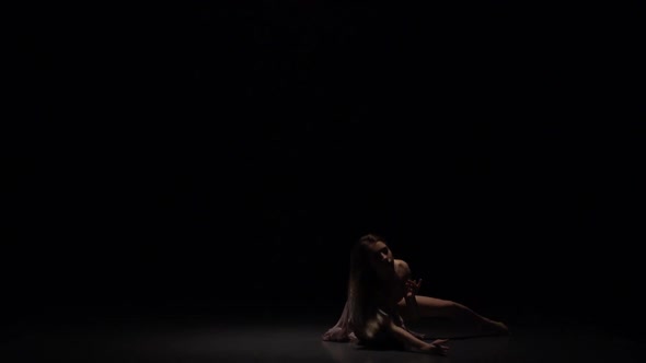 Female Performing Contemp in Twilight of Studio. Slow Motion alt