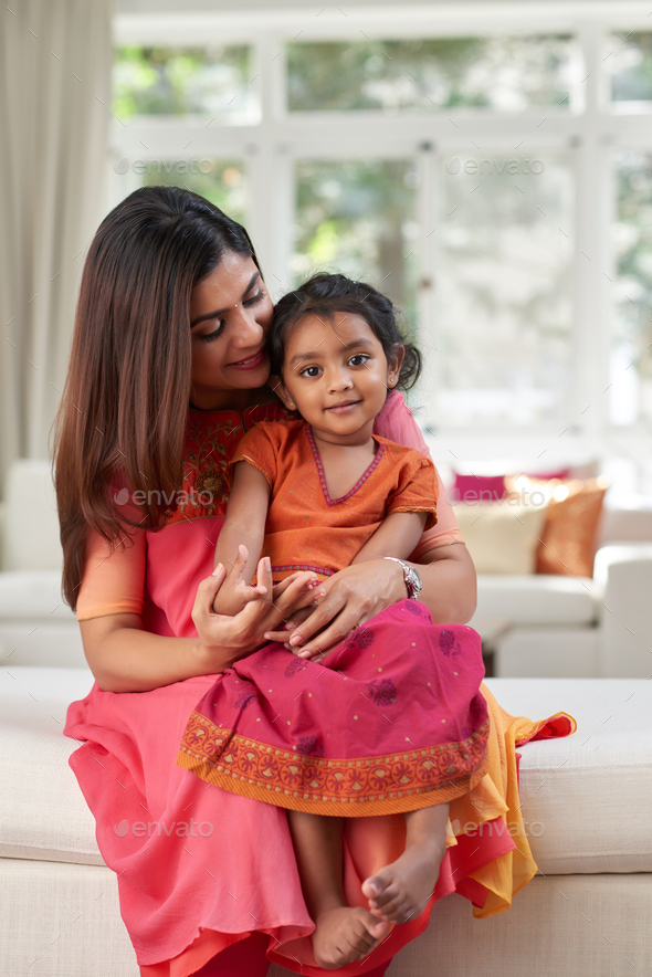 Image of Young Indian Girl Hugging Her Mother With Love, Feeling Happy.  Daughter And Mother Concept.-OA696452-Picxy
