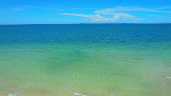 Drone flying at the tropical white beach with coconut trees alt