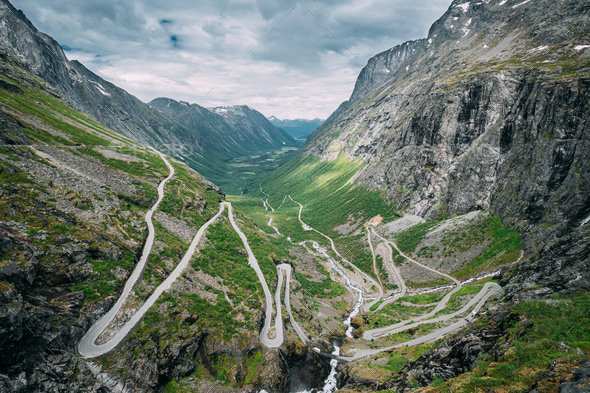 Trollstigen, Andalsnes, Norway. Cars Goes On Serpentine Mountain Road Trollstigen. Famous Norwegian - Stock Photo - Images