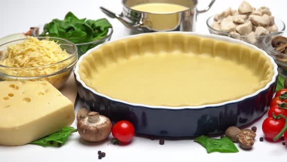 Shortbread Dough for Baking Quiche Tart in Baking Form and Ingredients alt
