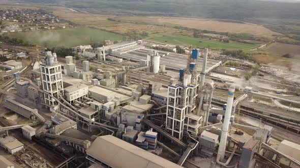 Aerial view of cement plant factory at industrial production area. alt