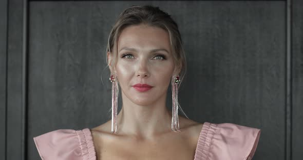 Beautiful Young Woman with Long Earrings