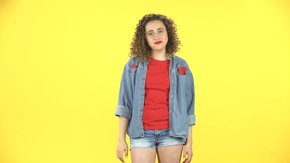 Girl Listens Carefully, Waving Her Hands in Indignation, Shrugs, Then Agrees and Laughs on Yellow alt