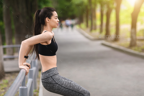 Outdoor Training. Asian Girl Exercising With Handrail In Park, Making Push Ups