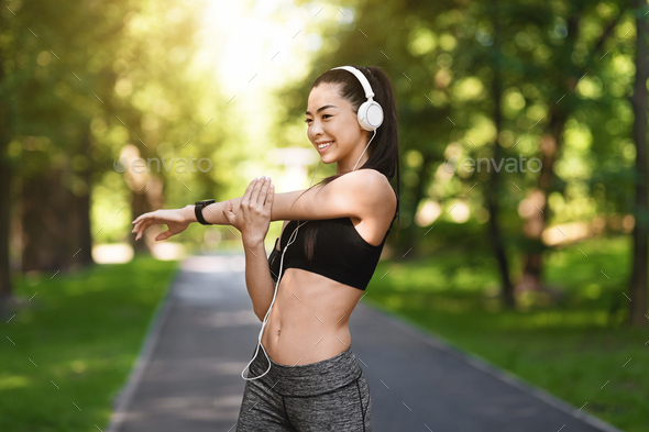 Outdoor Sport. Fit Millennial Girl Stretching Before Training In Park