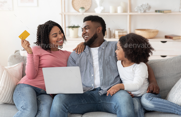 Easy Payments. Happy Black Family With Laptop And Credit Card Ordering Online