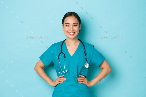 Covid-19, social distancing and coronavirus pandemic concept. Confident smiling asian doctor - Stock Photo - Images