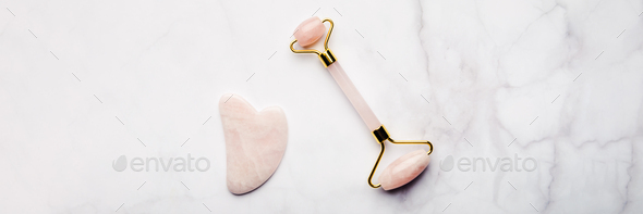 Jade face roller and Gua sha stone - Stock Photo - Images
