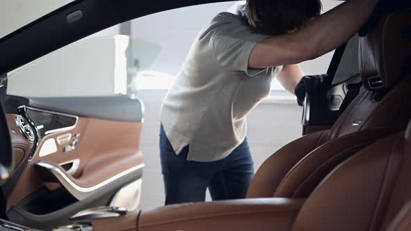 Wiping and Processing Leather Seats of the Car From Dust and Dirt