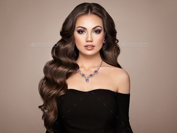 Brunette woman with curly hair - Stock Photo - Images