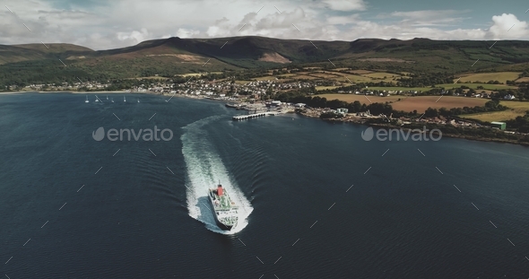 Scotland's ocean, passenger ferry aerial view in coastal water of Firth-of-Clyde Gulf, Brodick - Stock Photo - Images