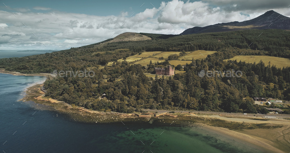 Scotland's Arran island landscape aerial zooming view: forests, meadows, mountains at summer day - Stock Photo - Images