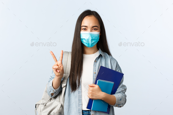 Covid-19 pandemic, education during coronavirus, back to school concept. Cute asian college student