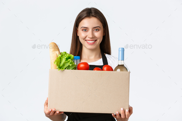 Employees, delivery and online orders, grocery stores concept. Friendly-looking pleasant young