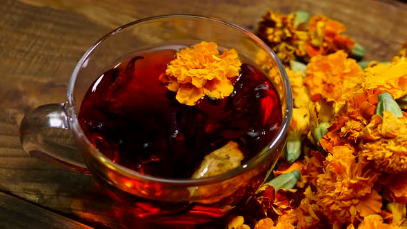 Antioxidant Close Up Natural Tea From Marigold Flowers Top View, Tea For Colds. Naturotherapy Drink.