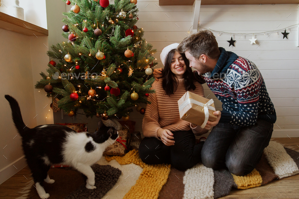 Couple exchanging Christmas gifts