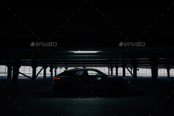Sports car in parking garage. Cinematic Stock Photo by Janne_Amunet