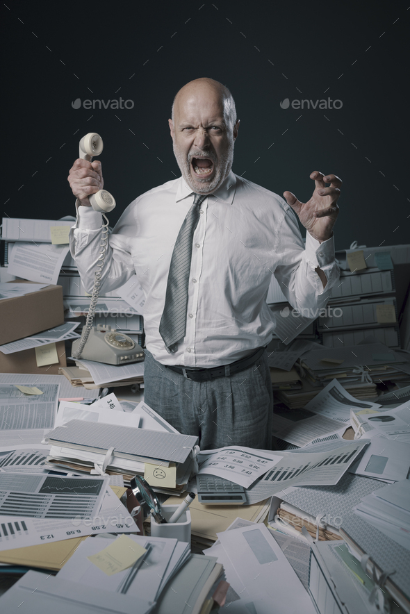 Stressed business executive overwhelmed by work