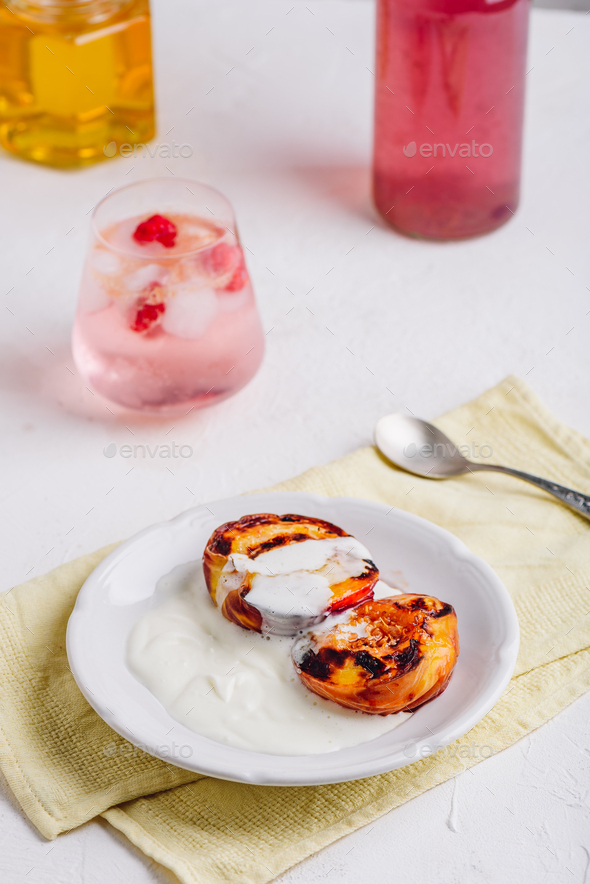Oven baked peaches with honey and whipped cream