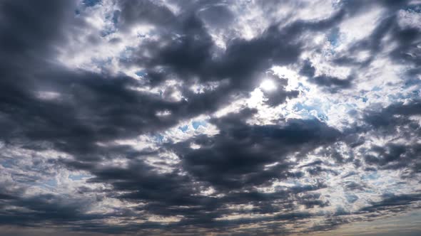 Dramatic Cumulus Cirrus Clouds Move in the Blue Sky. Sunbeams Shine. Time Lapse alt