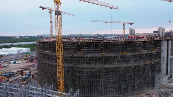 High Tower Cranes Near Future Sports Stadium Building alt