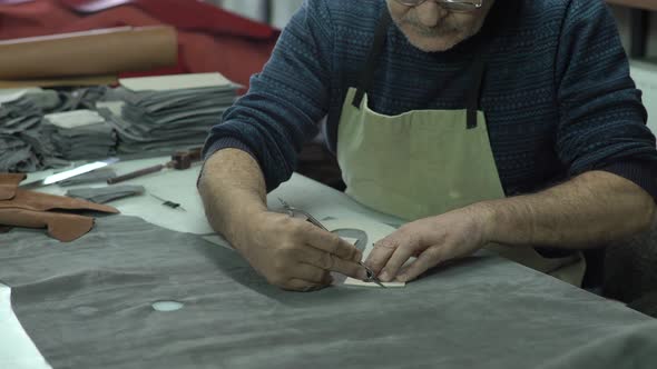 Shoemaker Cuts Suede Leather With Scalpel