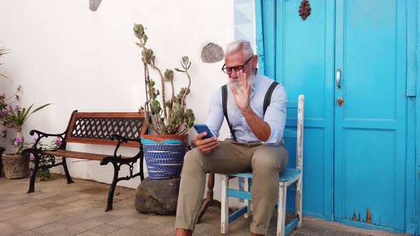 Senior Man with a Phone alt