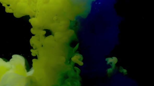 Green And Blue Paint In Water. Slow Motion