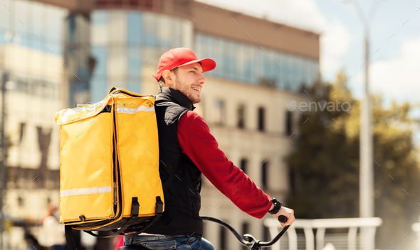 Professional Courier With Backpack Riding Bike Delivering Food In City