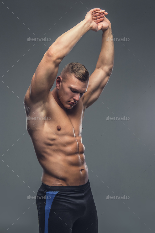 Shirtless Muscular Man Isolated On A Grey Background. Stock Photo By ...