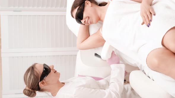 Flash of Diode Laser Hair Removal Beautician Removes Hair on Beautiful Female Armpits Hair Removal alt