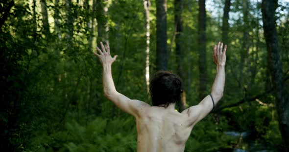 Naked Man Raised His Hands and Wants to Surrender alt