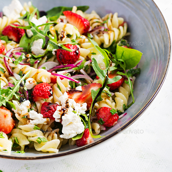 Pasta salad. Fusilli Pasta salad with strawberry, feta cheese, red