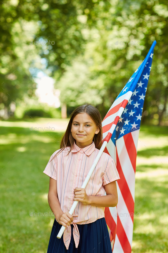 Girl Holding American Flag Outdoors