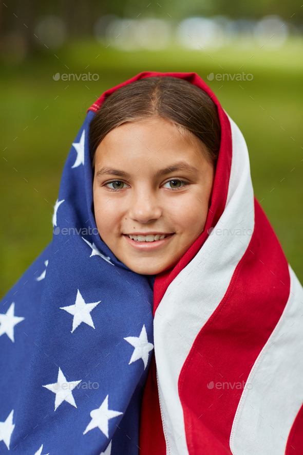 Smiling Girl Covered by Flag Blanket