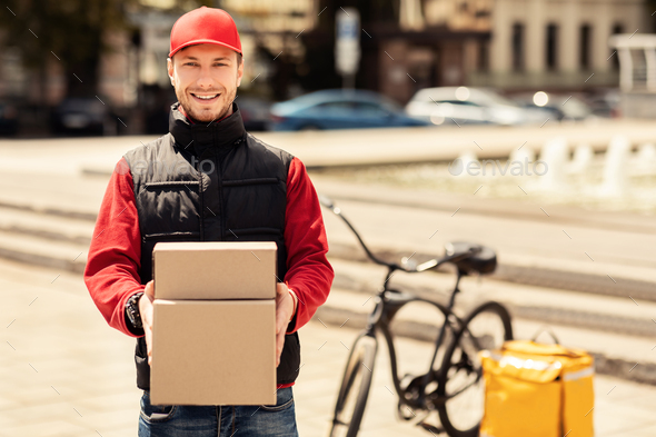 Happy Courier Holding Boxes Smiling Delivering Parcels In City