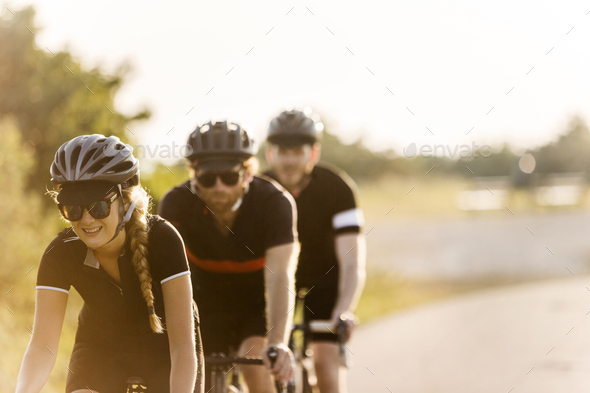 Three cyclists in rural setting