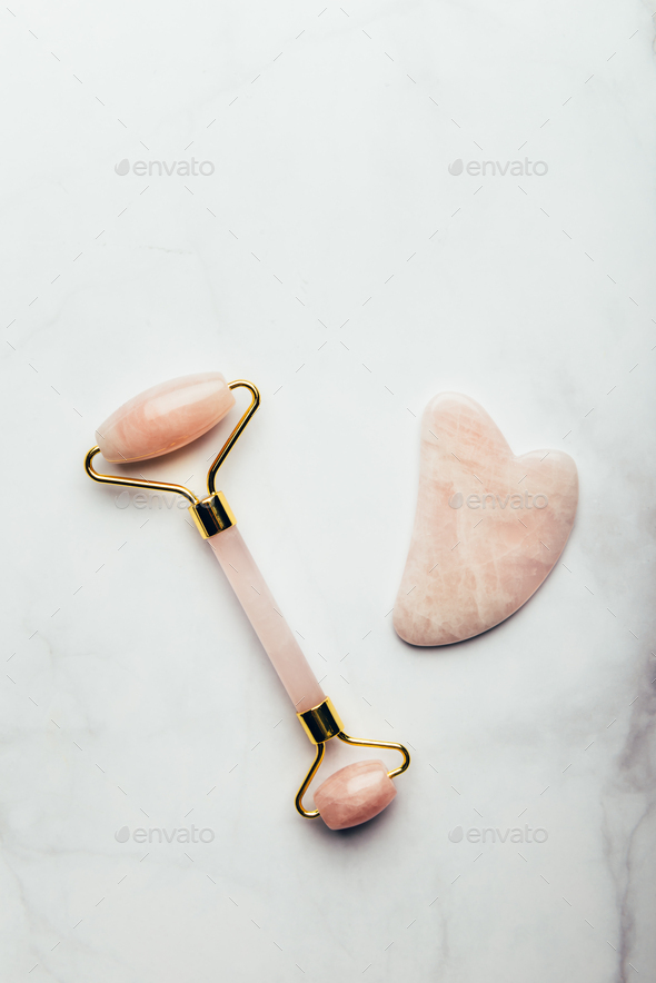 Jade face roller and Gua sha stone - Stock Photo - Images